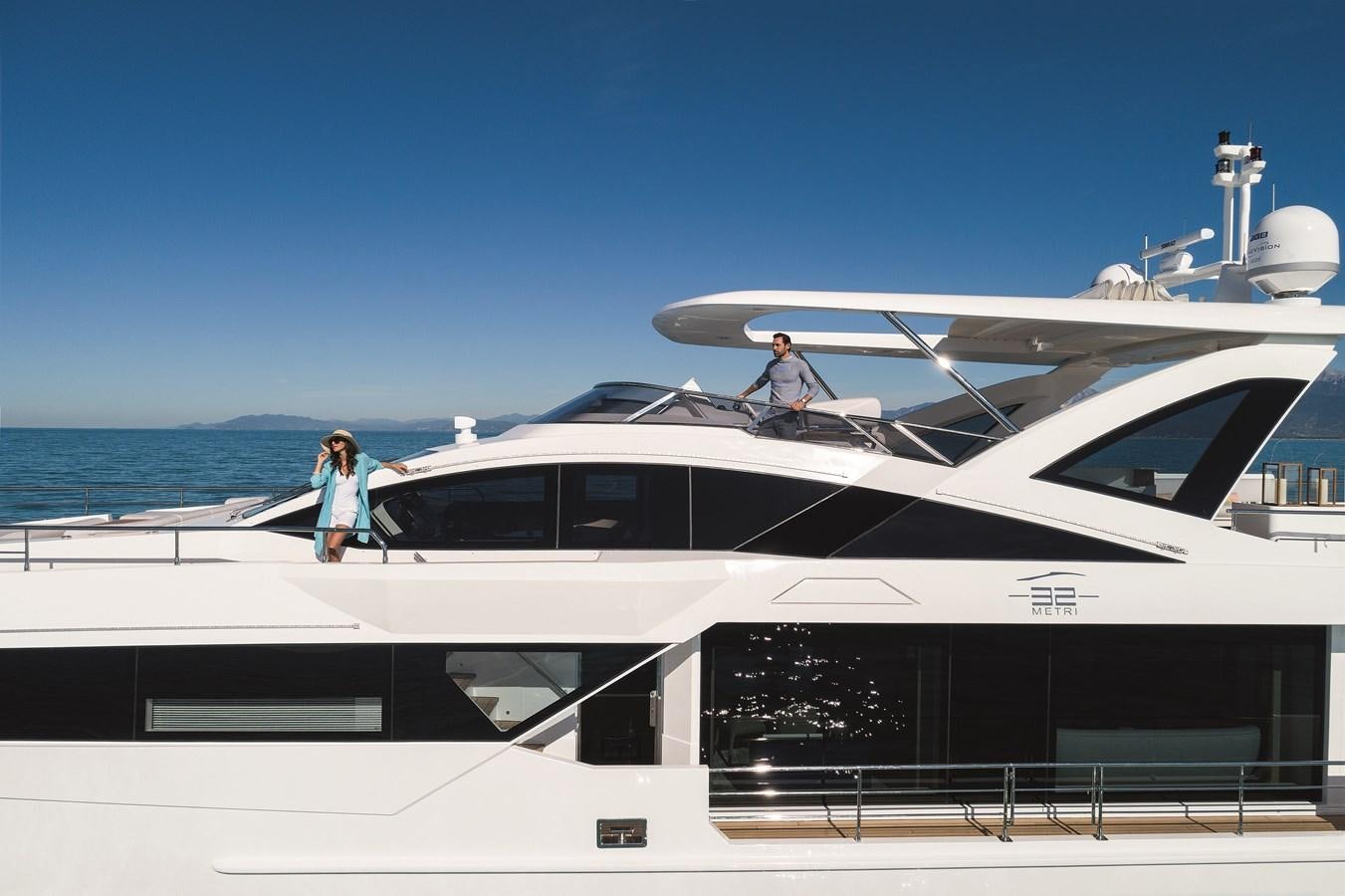 a couple people on a yacht aboard LA MAMA Yacht for Sale