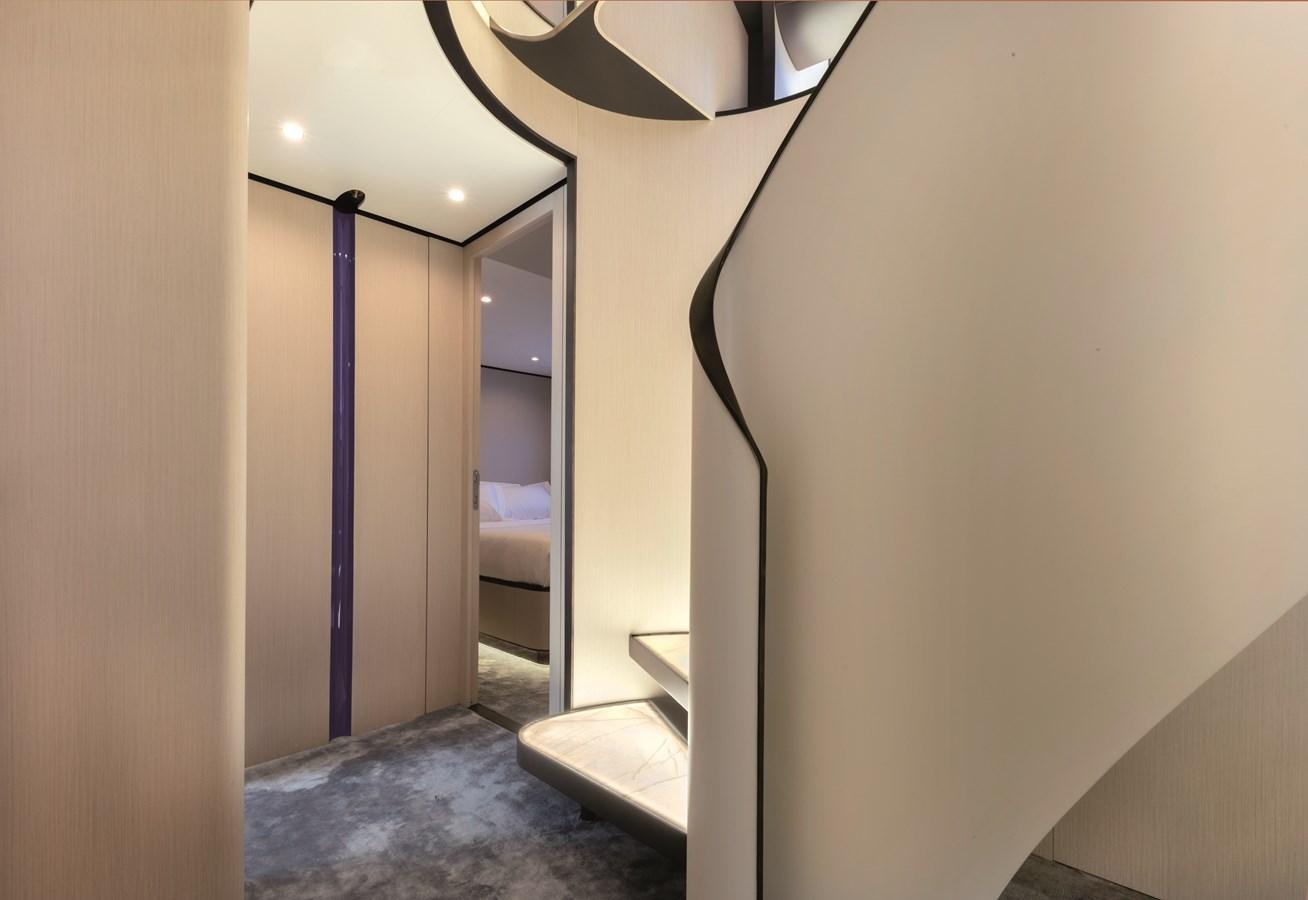 a hallway with a door and a bed aboard LA MAMA Yacht for Sale
