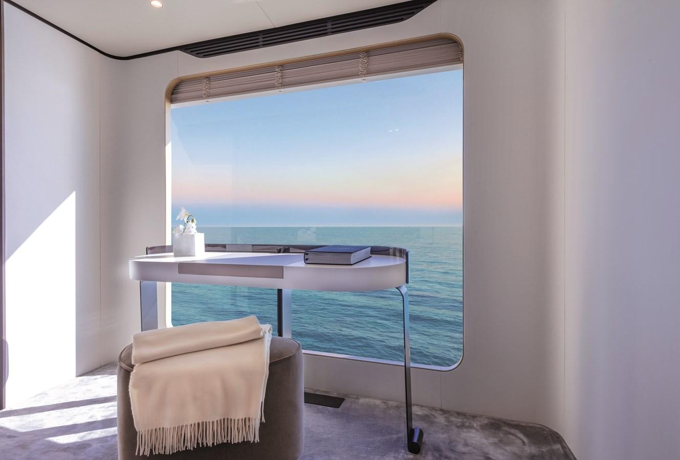 a room with a table and chairs aboard LA MAMA Yacht for Sale