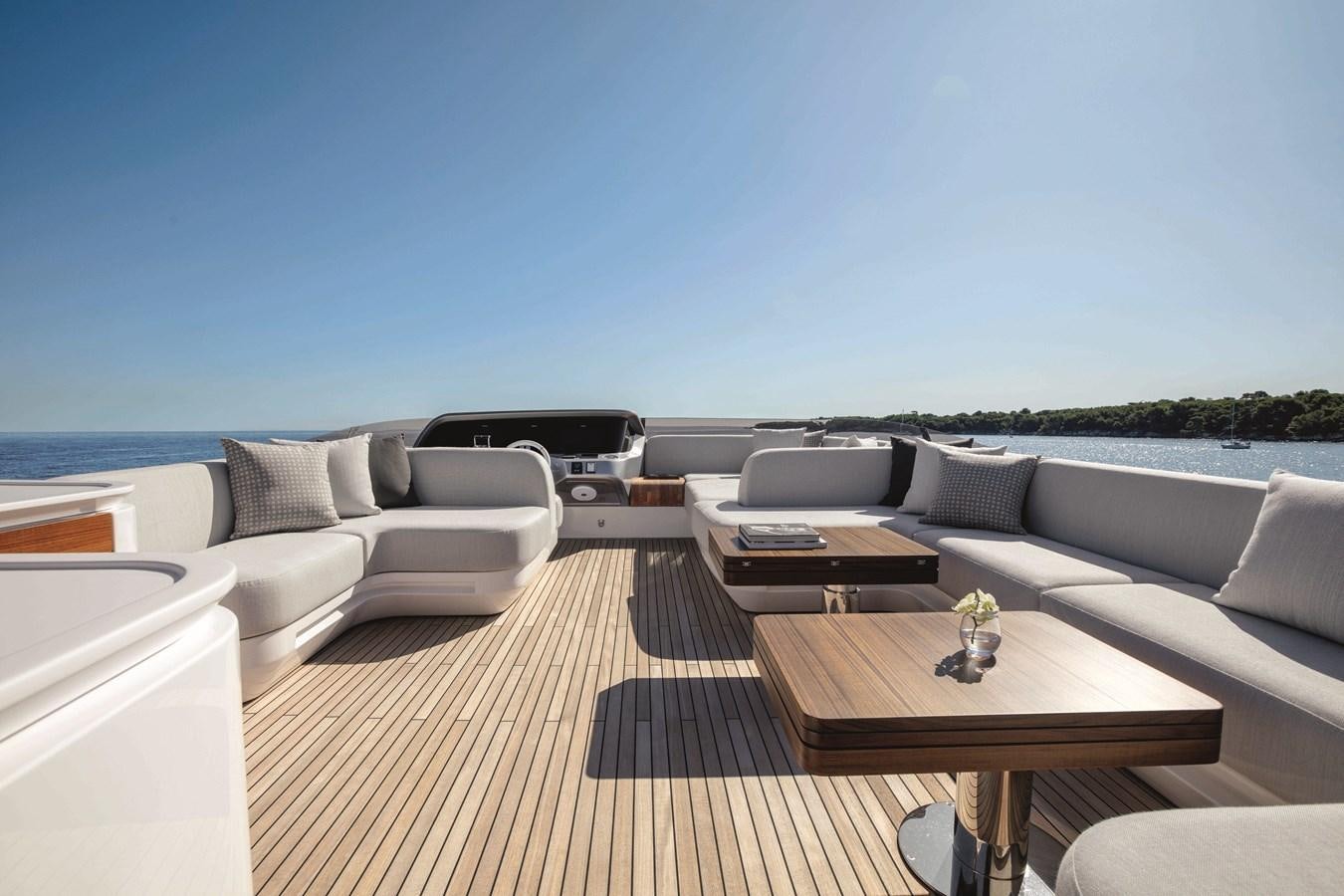 a living room with a couch and a table aboard AZIMUT S10/20 Yacht for Sale