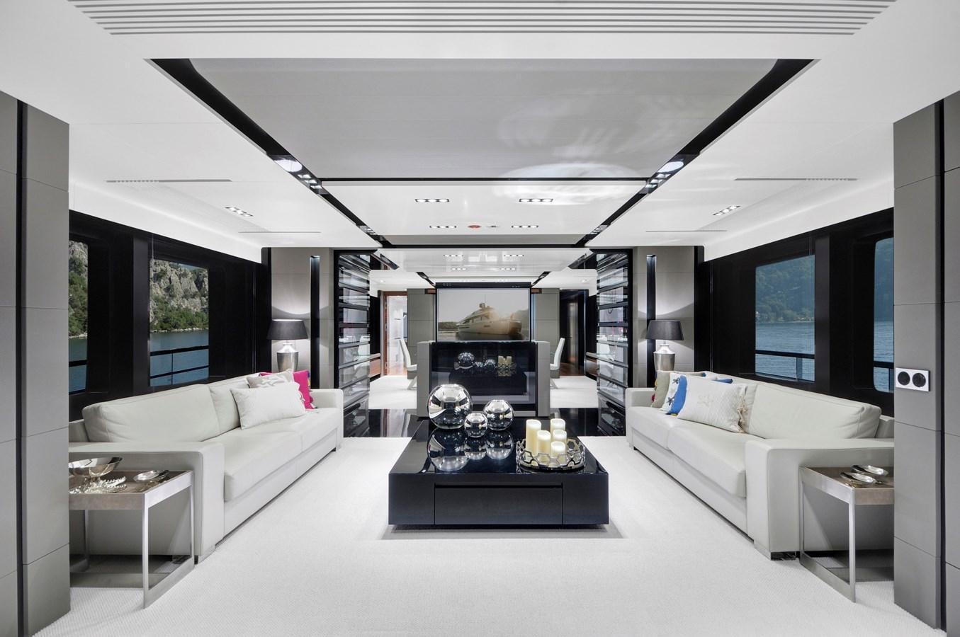 a living room with white couches aboard FX Yacht for Charter