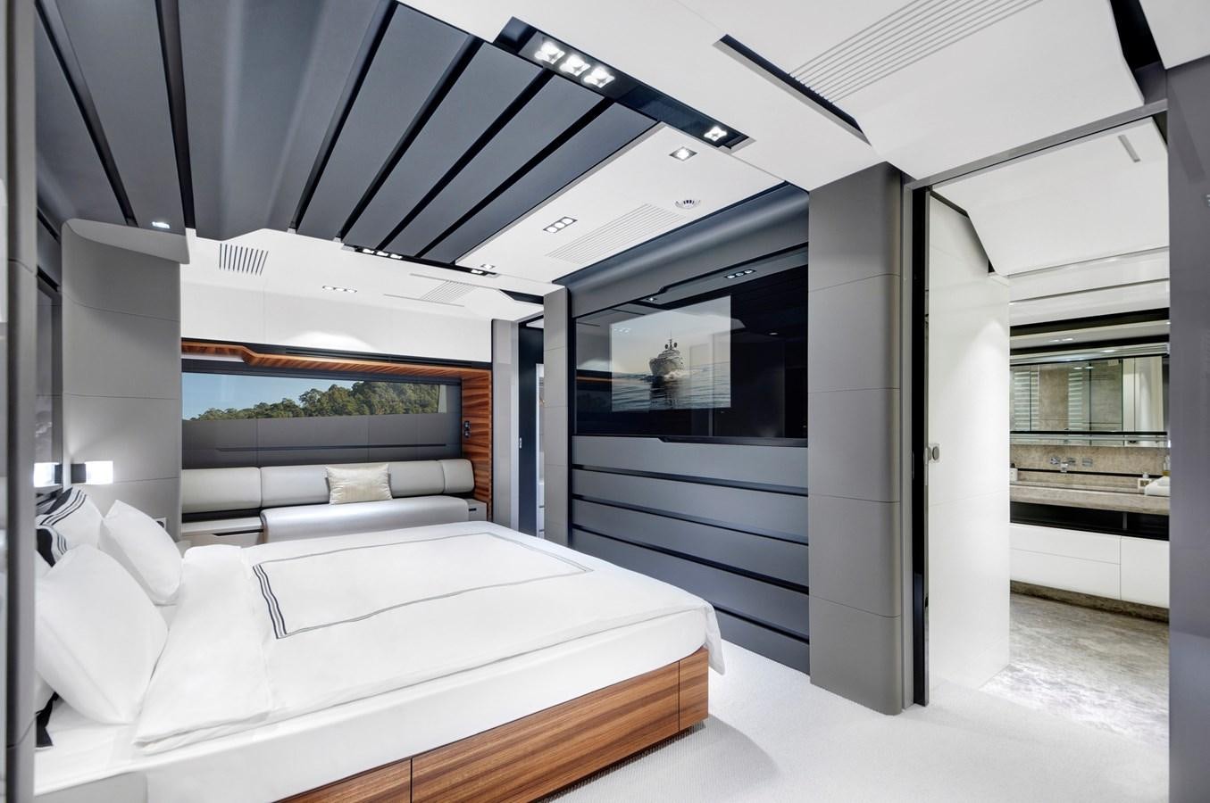 a room with a bed and a large window aboard FX Yacht for Sale