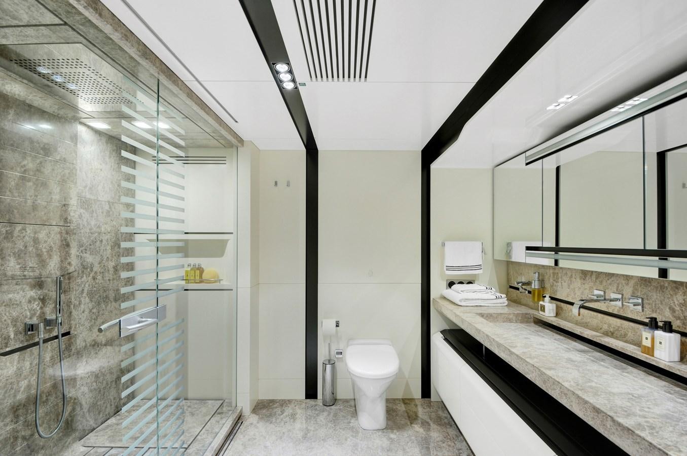 a bathroom with a glass shower aboard FX Yacht for Sale