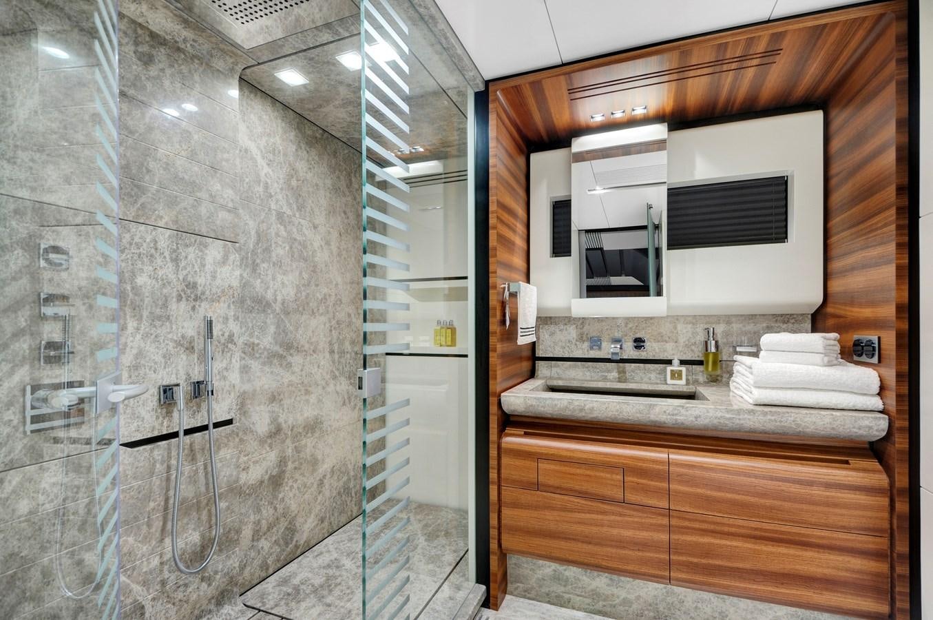 a bathroom with a glass shower aboard FX Yacht for Sale