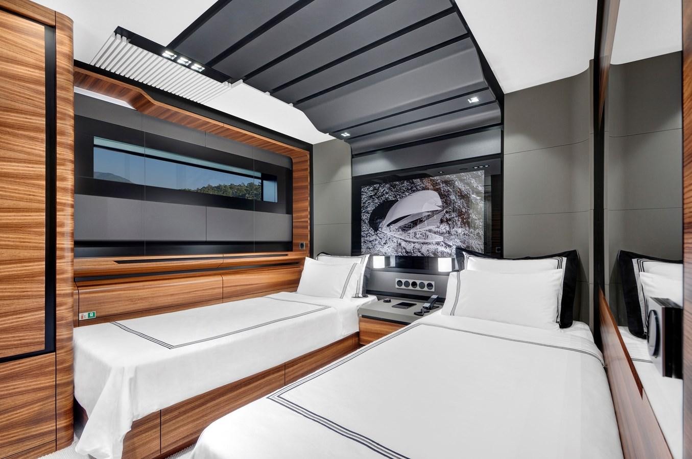 a room with two beds aboard FX Yacht for Sale