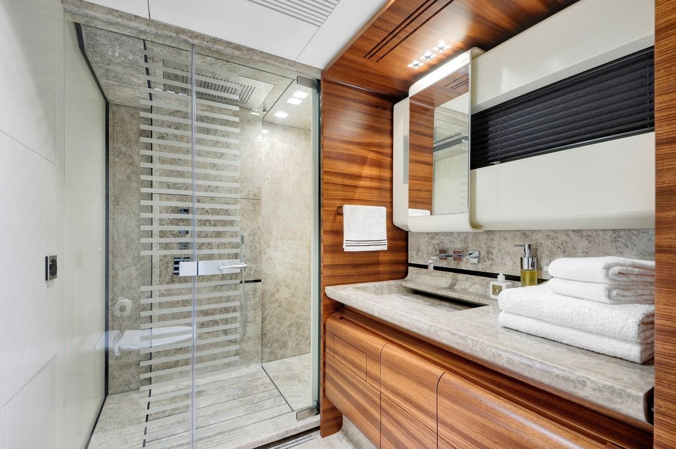 a bathroom with a glass shower aboard FX Yacht for Sale