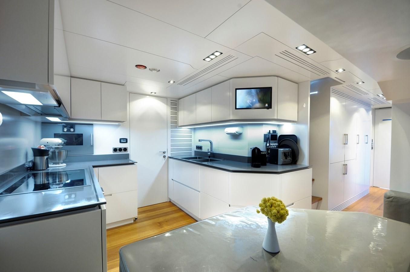 a kitchen with a microwave oven and a microwave oven aboard FX Yacht for Sale