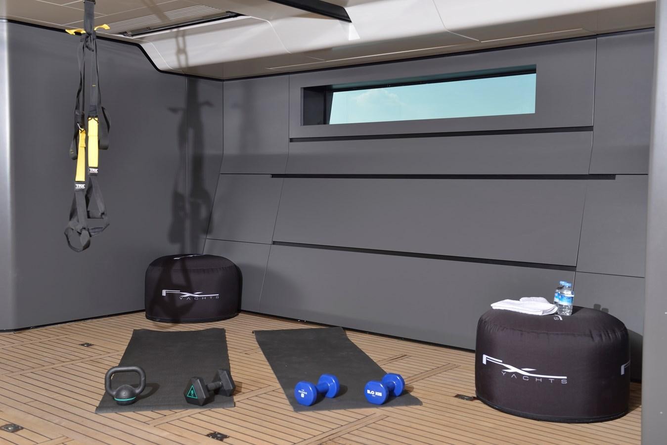 a room with a table and electronics aboard FX Yacht for Charter