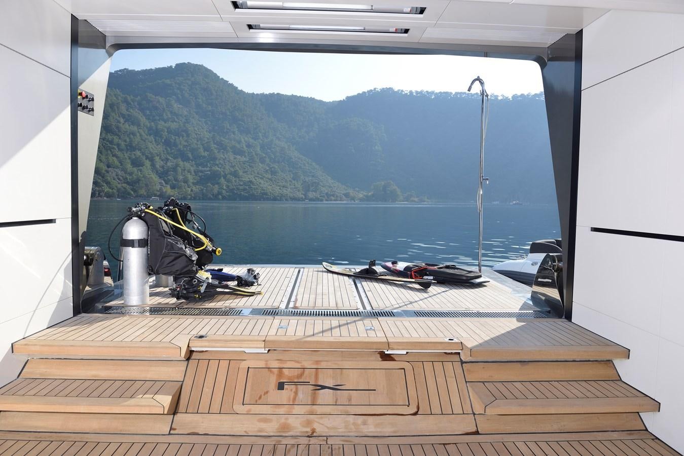 a view of a mountain from a window aboard FX Yacht for Charter