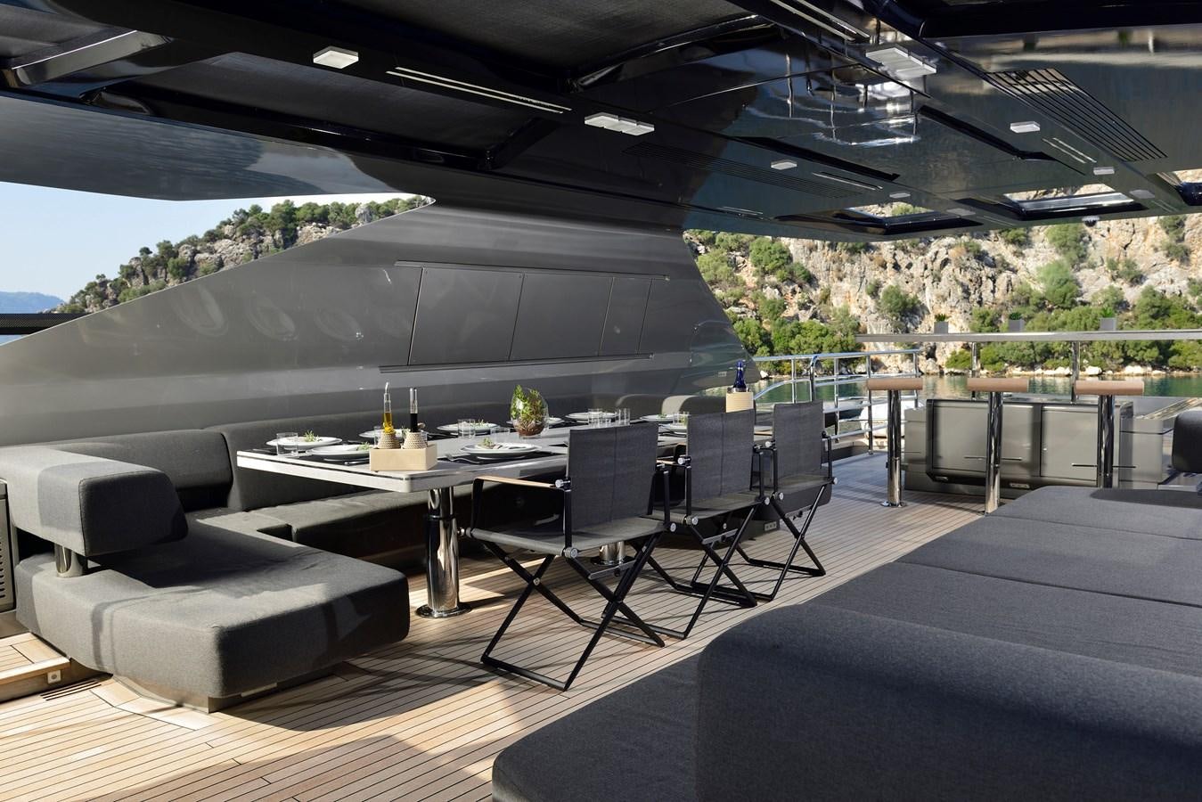 a large modern looking room with a large swimming pool aboard FX Yacht for Sale