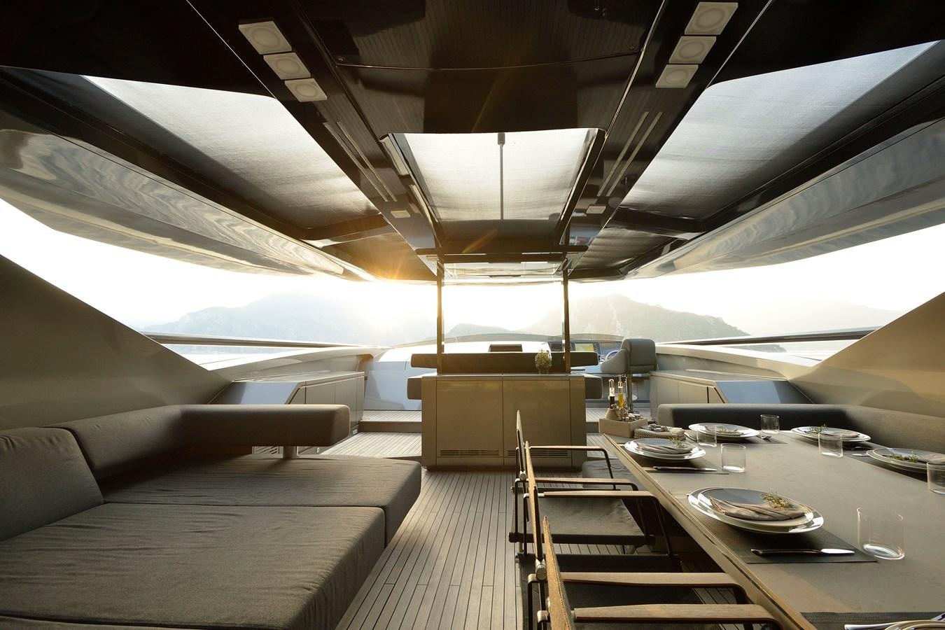 inside of a building with a table and chairs aboard FX Yacht for Sale