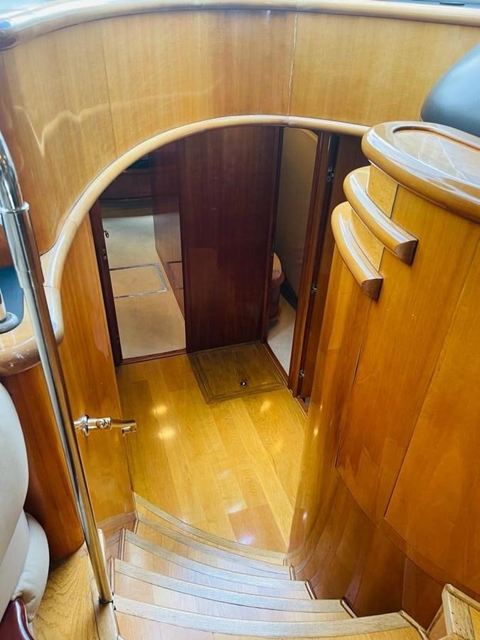 a bathroom with a round mirror aboard LADY ESTHER  Yacht for Sale