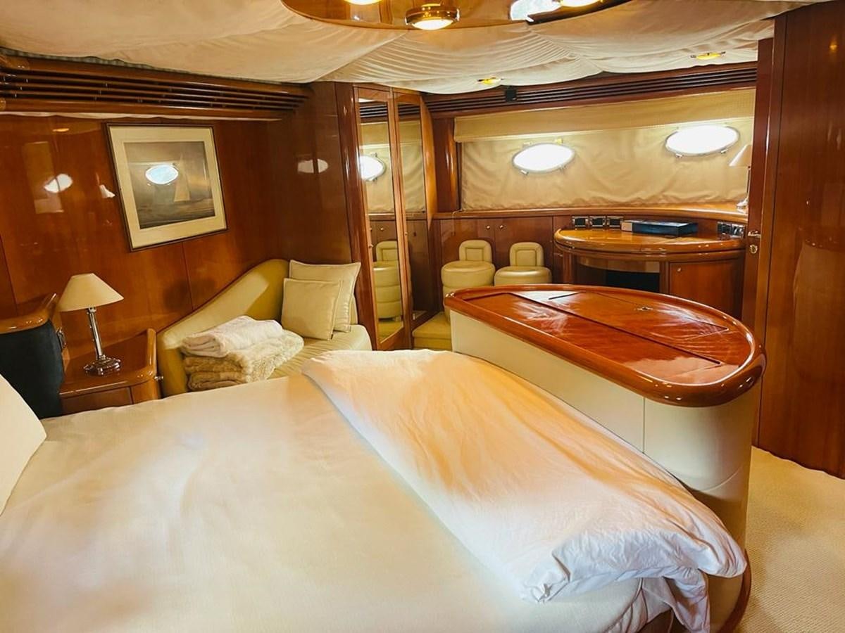 a room with a bed and a desk aboard LADY ESTHER  Yacht for Sale