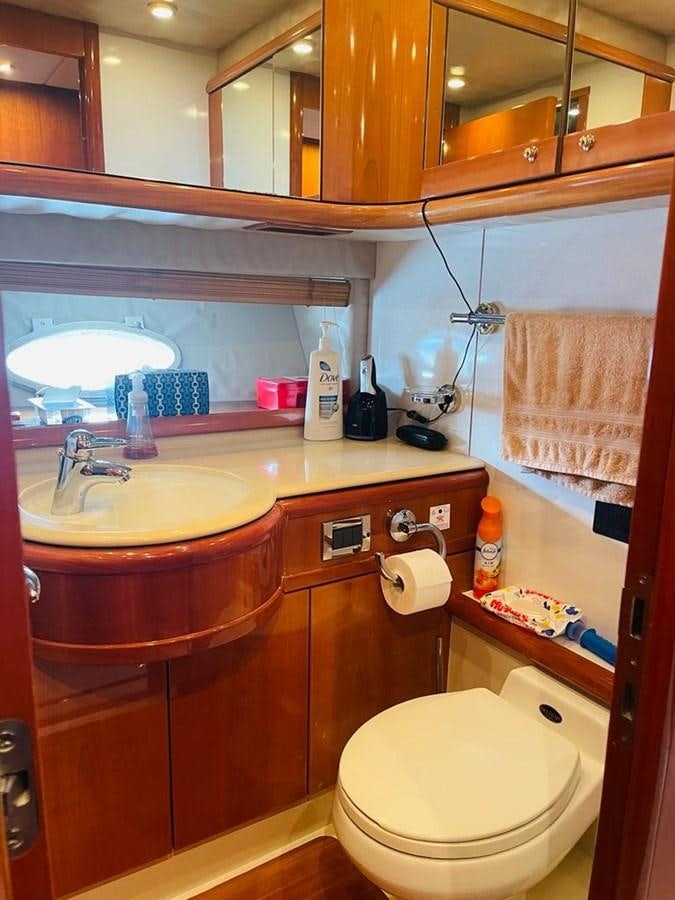a bathroom with a large mirror aboard LADY ESTHER  Yacht for Sale