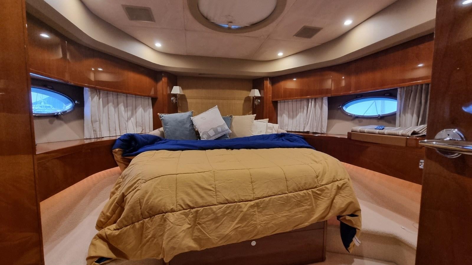 a room with a bed and a window aboard SERENA Yacht for Sale