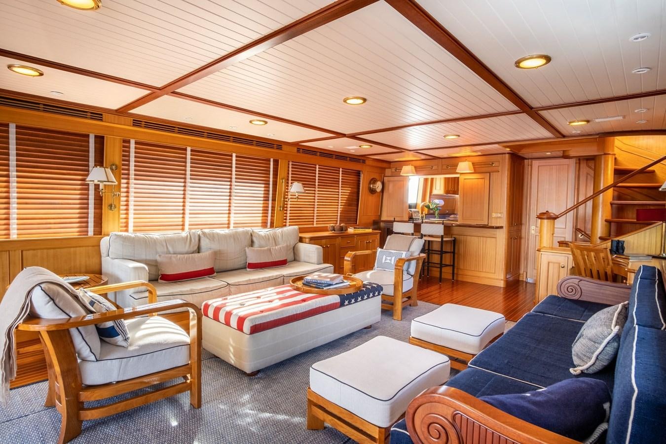 a living room with a couch and a table aboard FORTUNA Yacht for Sale