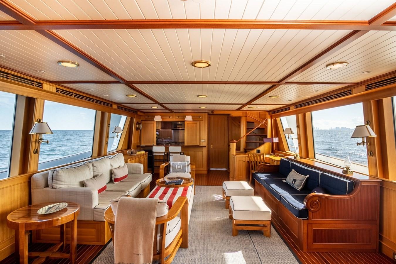 a living room with a couch and a table aboard FORTUNA Yacht for Sale