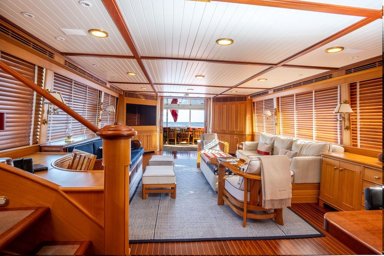 a room with a couch and a table aboard FORTUNA Yacht for Sale