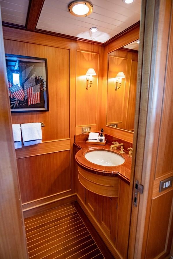 a bathroom with a sink and a mirror aboard FORTUNA Yacht for Sale