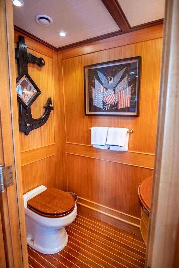a bathroom with a painting on the wall aboard FORTUNA Yacht for Sale