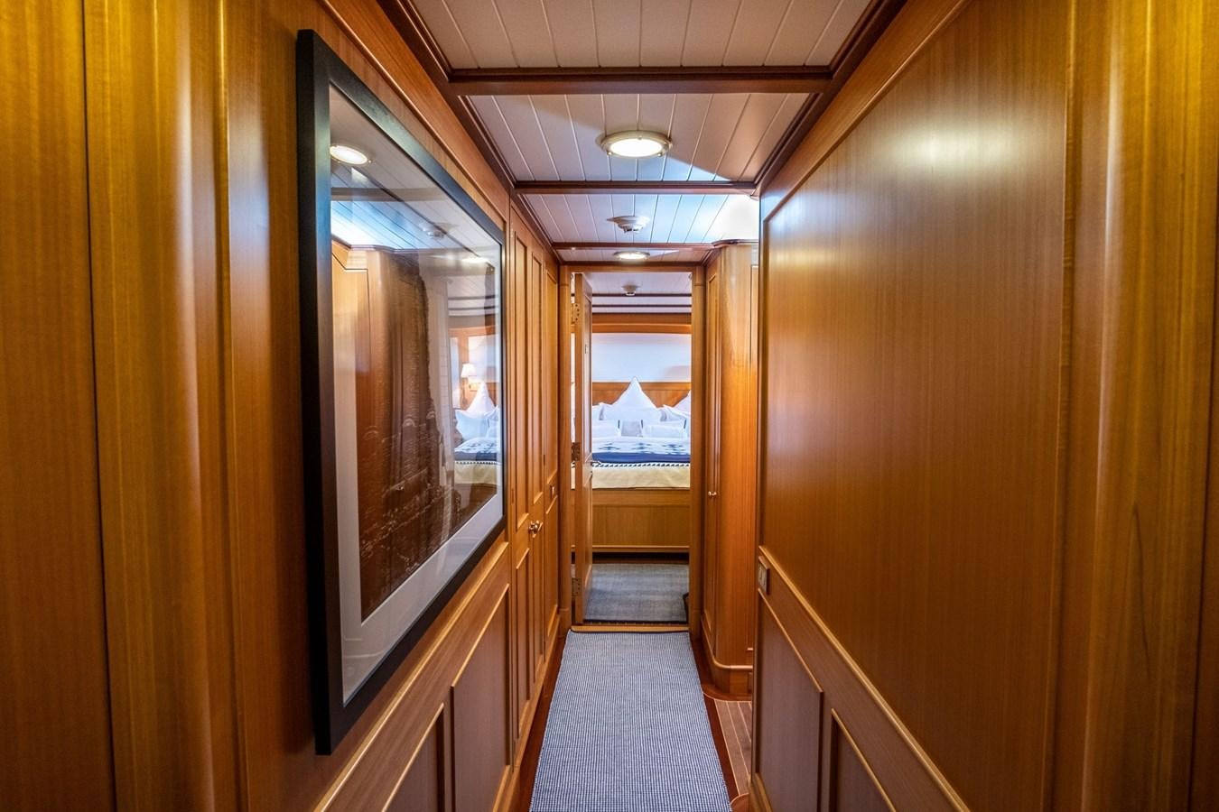 a hallway with wooden doors aboard FORTUNA Yacht for Sale
