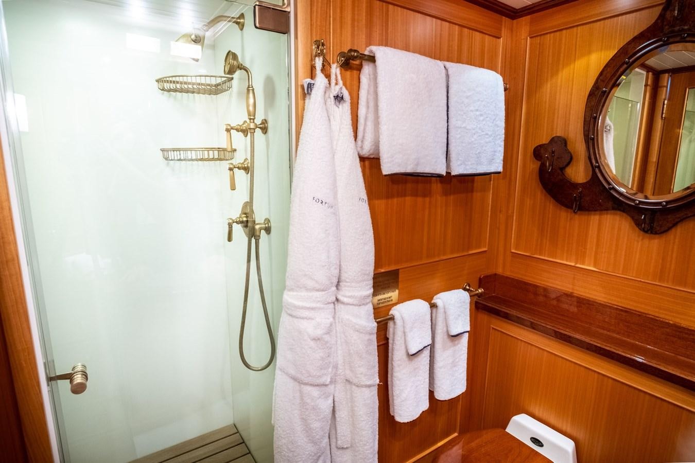 a bathroom with a towel rack and a mirror aboard FORTUNA Yacht for Sale