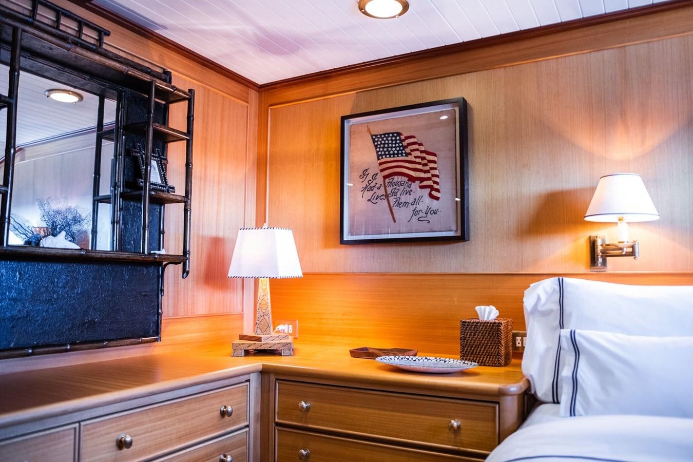 a room with a desk and a bed aboard FORTUNA Yacht for Sale