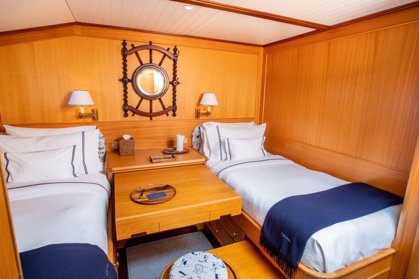 a room with two beds aboard FORTUNA Yacht for Sale