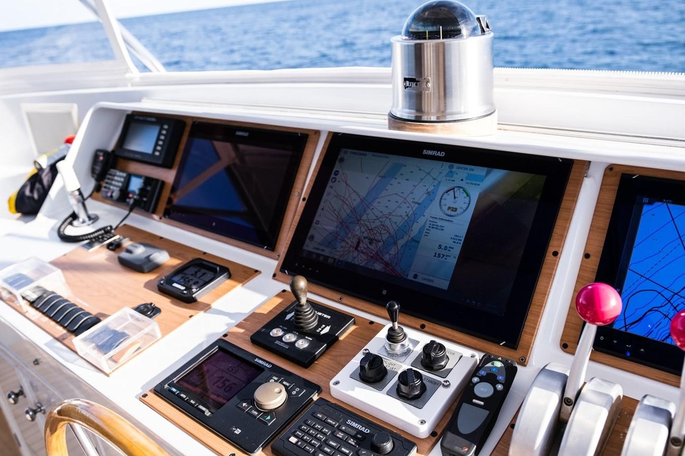 a desk with a computer and a window aboard FORTUNA Yacht for Sale