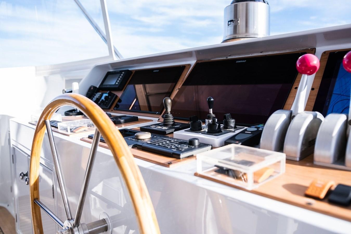 a desk with a computer and a lamp on it aboard FORTUNA Yacht for Sale