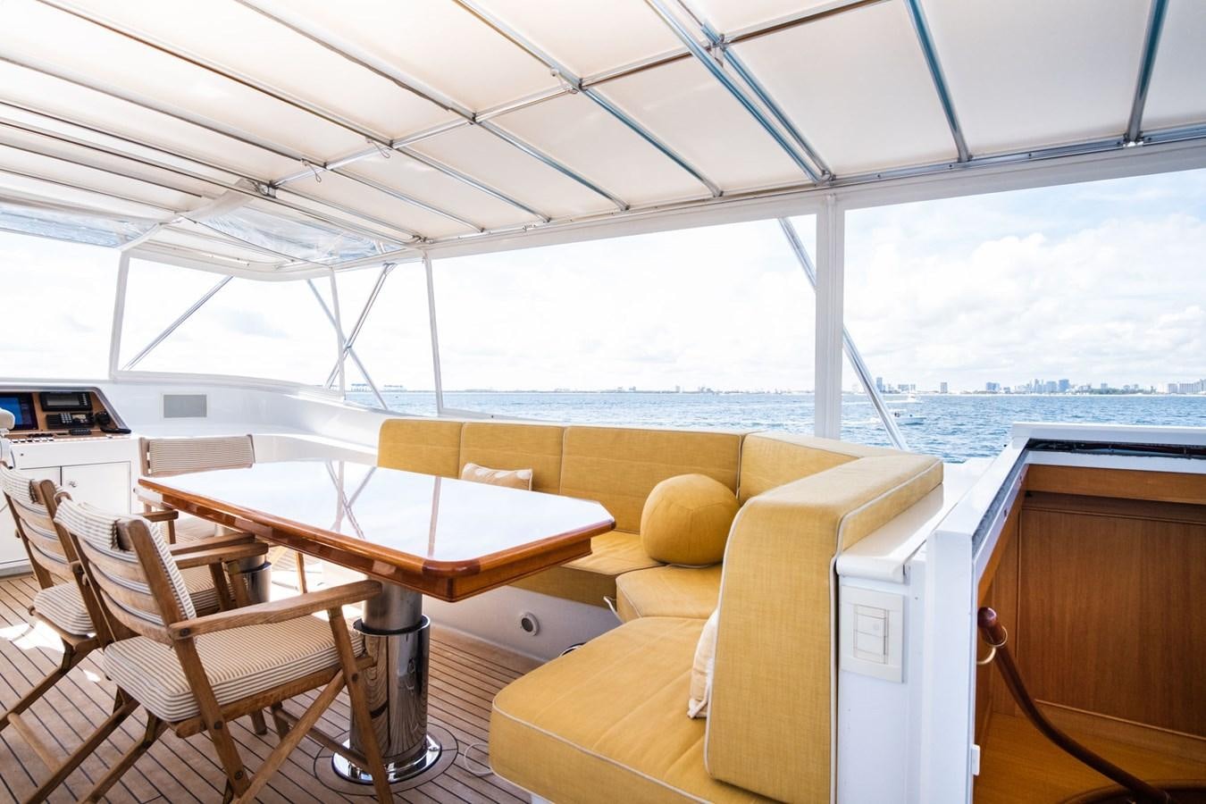 a room with a table and chairs aboard FORTUNA Yacht for Sale