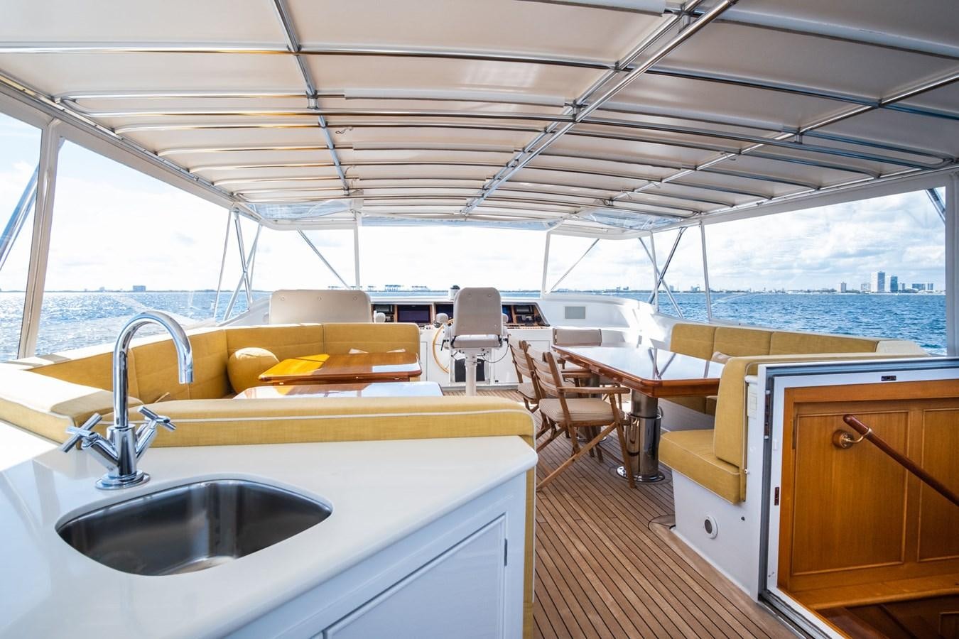 a kitchen with a sink and a large window aboard FORTUNA Yacht for Sale