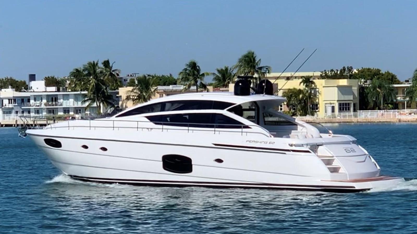 a white yacht in the water aboard PERSHING 6X Yacht for Sale