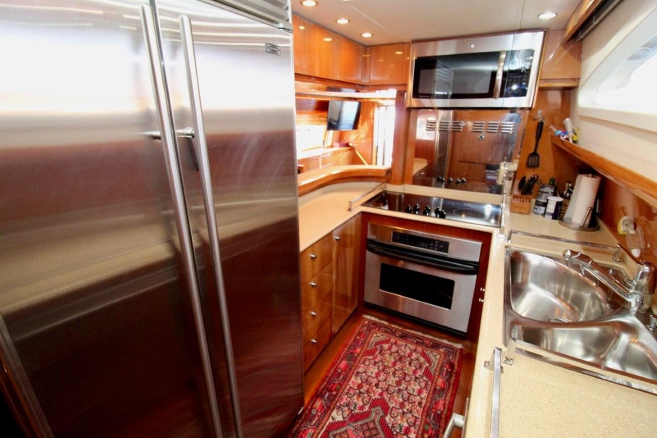 a kitchen with a stainless steel oven aboard AVICCI Yacht for Sale