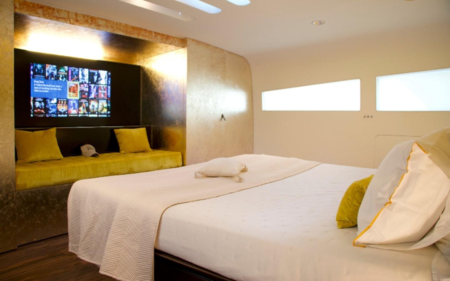 a room with beds and a tv aboard PAB Yacht for Sale