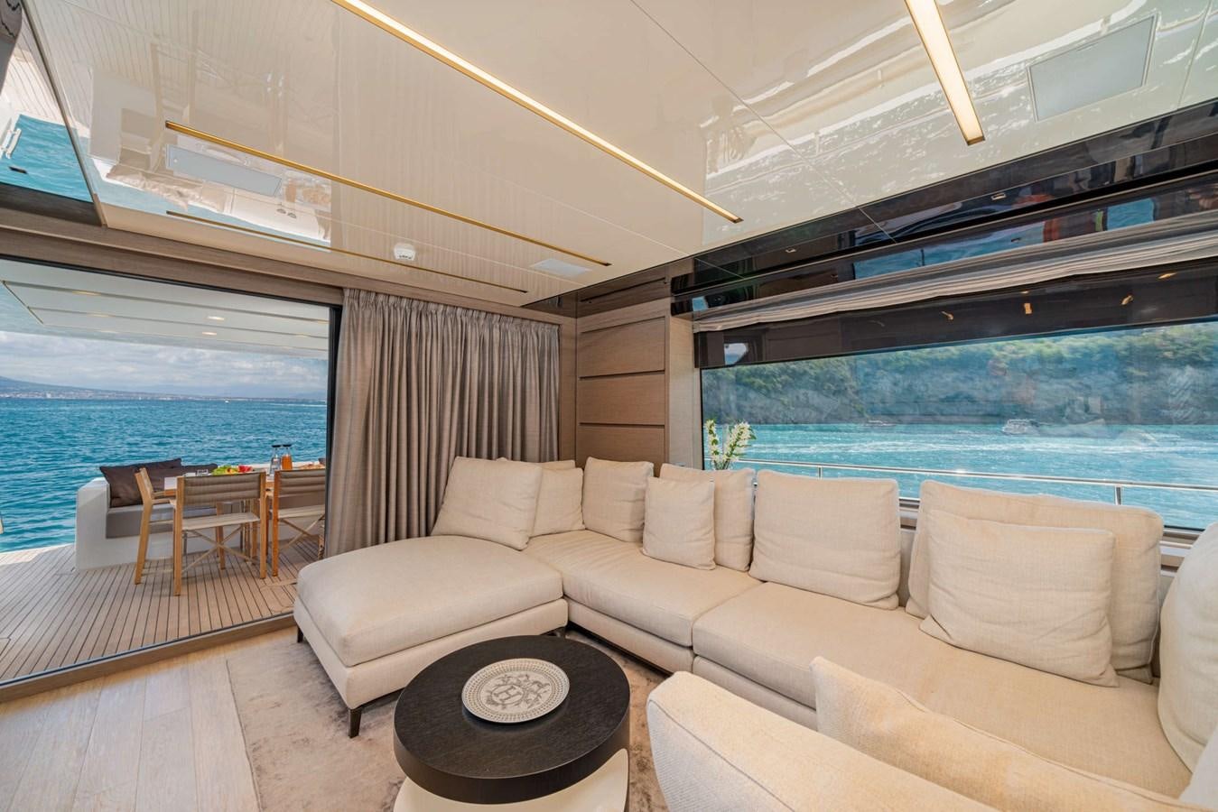 a living room with a large window aboard LUCKY Yacht for Sale