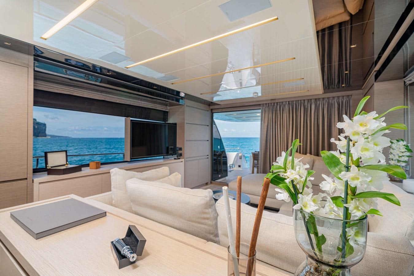 a room with a table and chairs aboard LUCKY Yacht for Sale