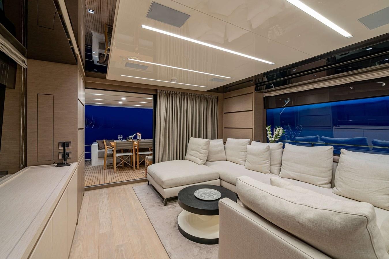 a living room with a large window aboard LUCKY Yacht for Sale