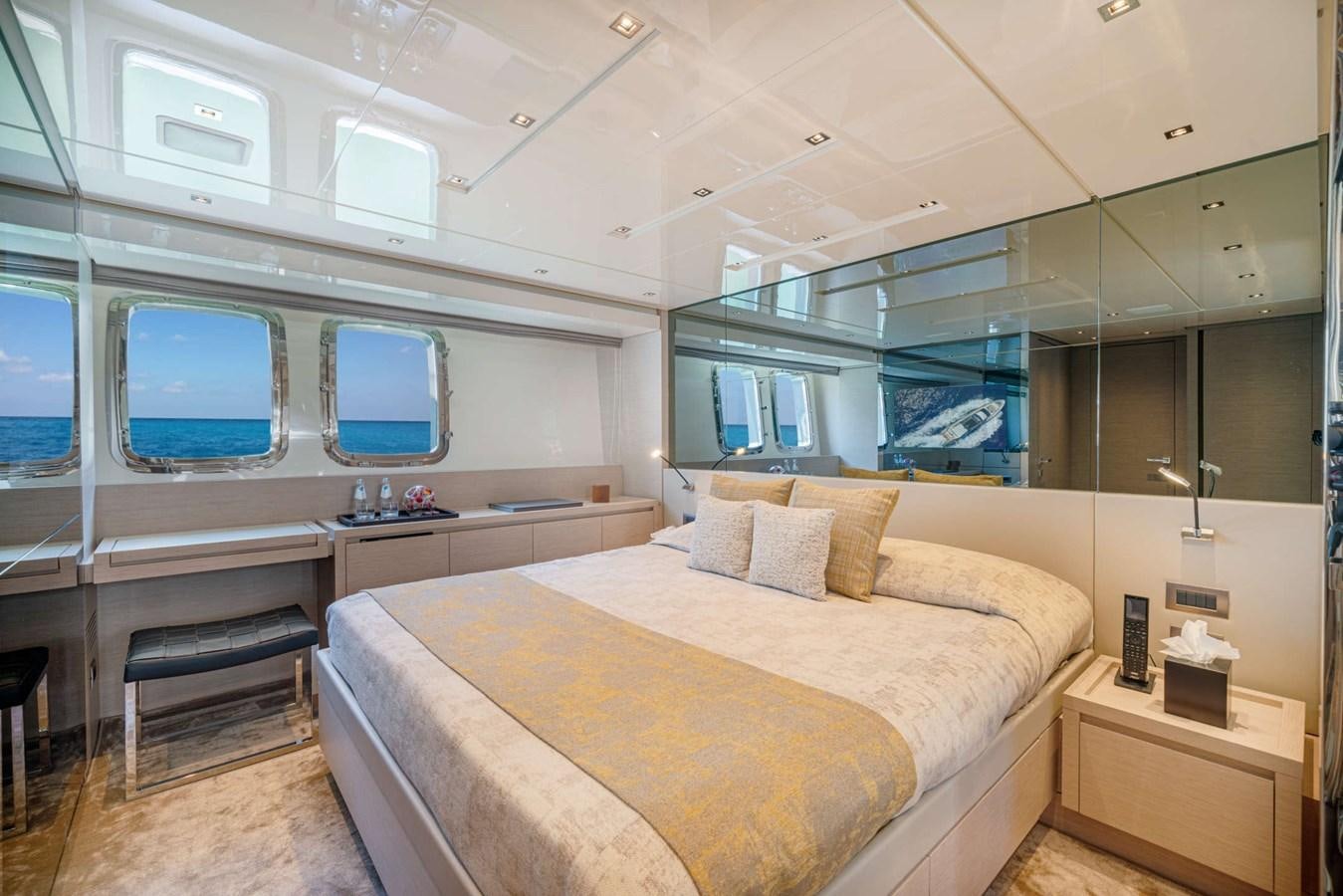 a room with a bed and a desk aboard LUCKY Yacht for Sale