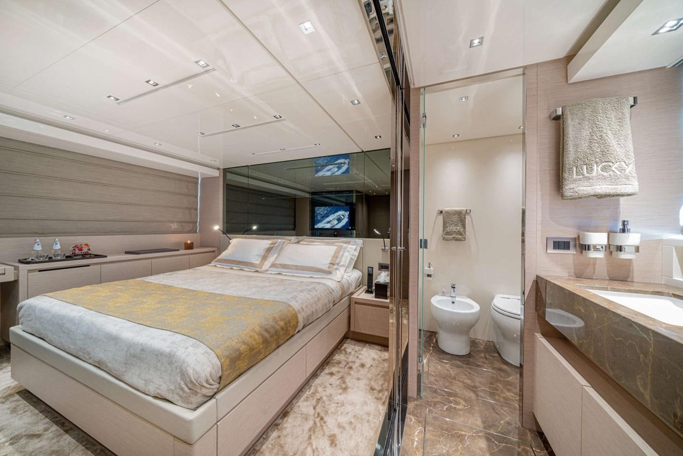 a large bathroom with a tub and toilet aboard LUCKY Yacht for Sale