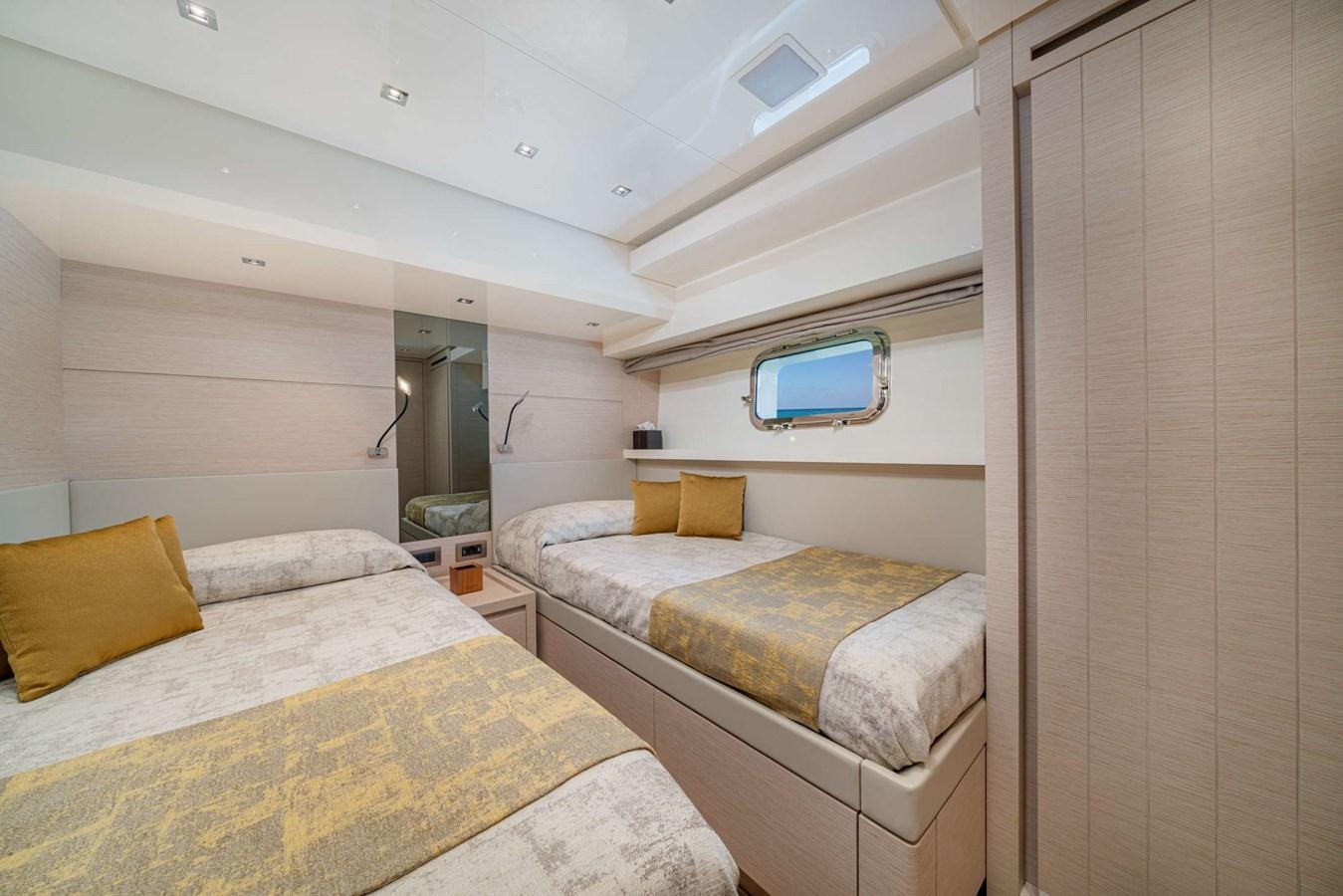 a room with two beds aboard LUCKY Yacht for Sale