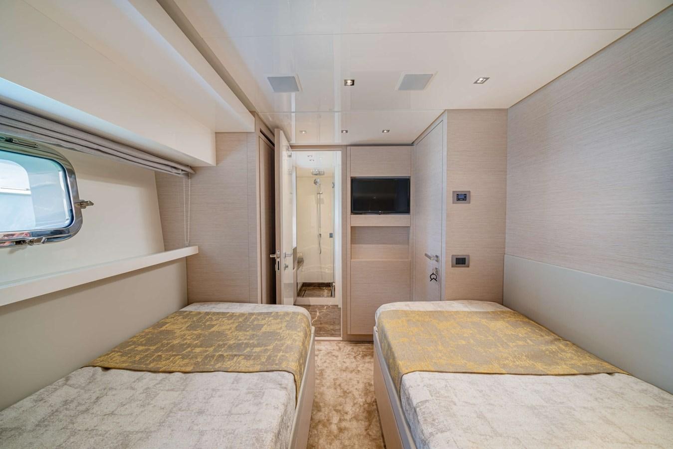 a room with a bed and a tv aboard LUCKY Yacht for Sale