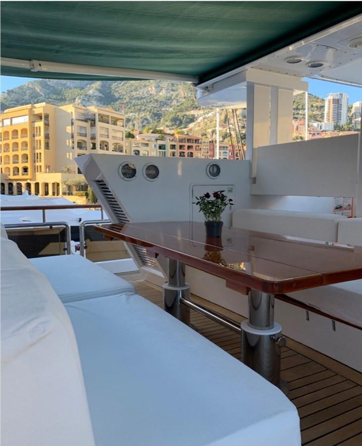 a room with a table and chairs aboard BAHIRA II Yacht for Sale