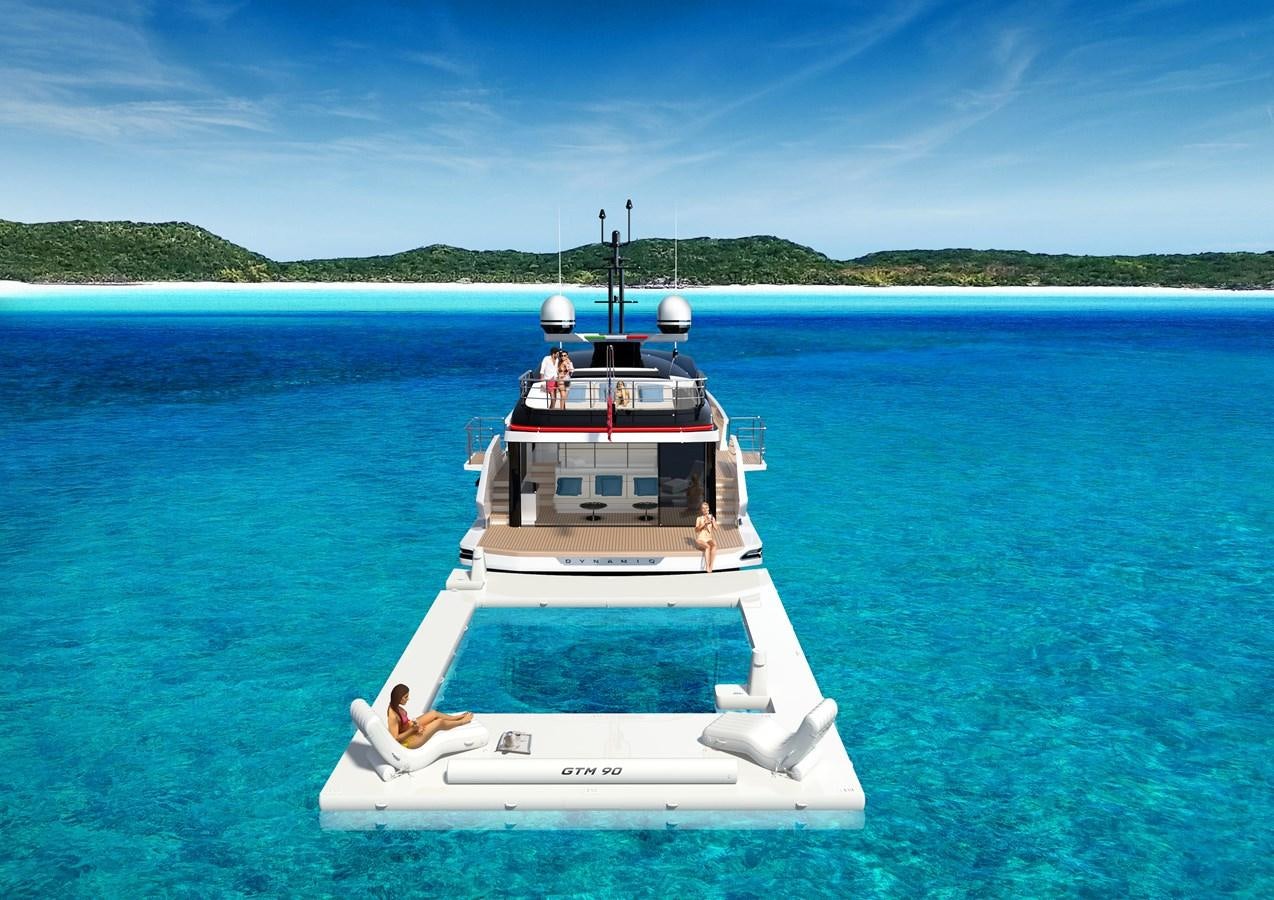 a boat in the water aboard DYNAMIQ GTM 90 TRANSFORMER Yacht for Sale