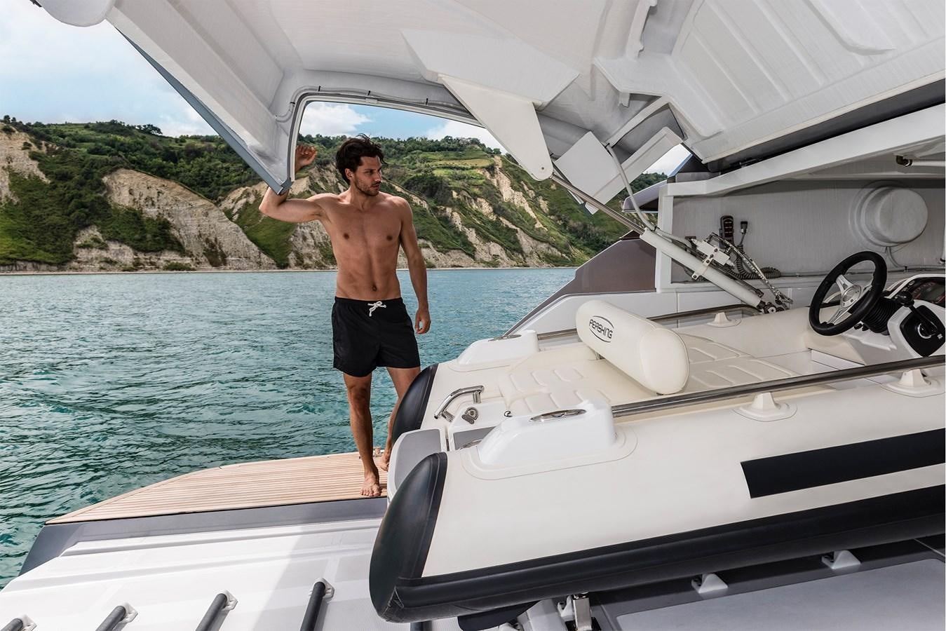 a man standing on a boat aboard PERSHING 8X   Yacht for Sale