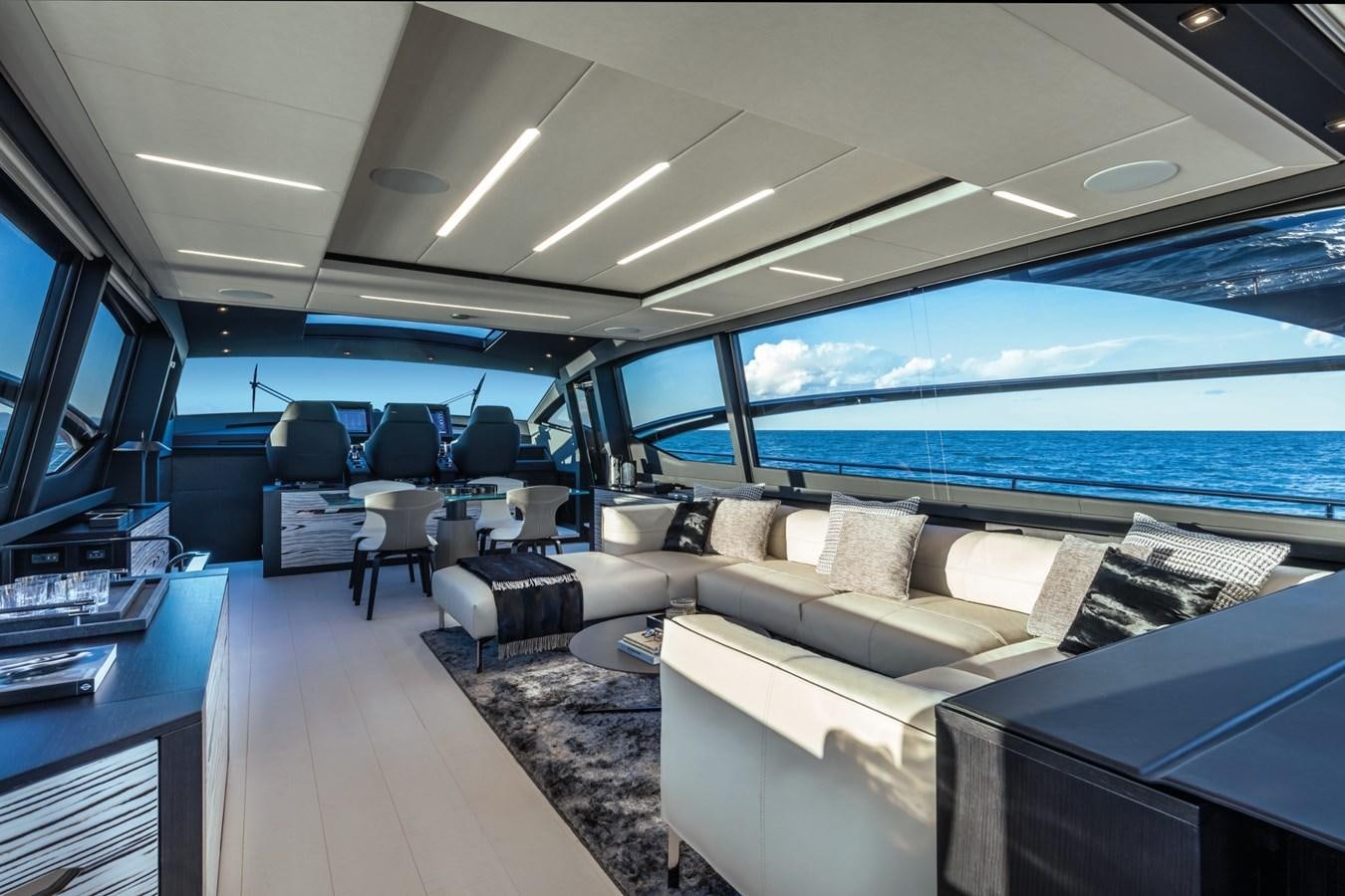 inside of a vehicle with a large window and a view of the ocean aboard PERSHING 8X   Yacht for Sale