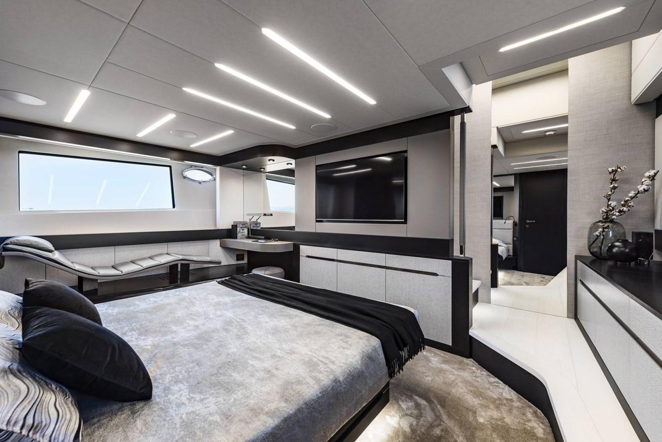 a room with a bed and a tv aboard PERSHING 8X   Yacht for Sale