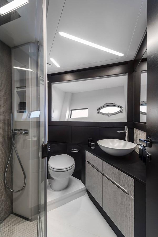 a bathroom with a sink and a toilet aboard PERSHING 8X   Yacht for Sale