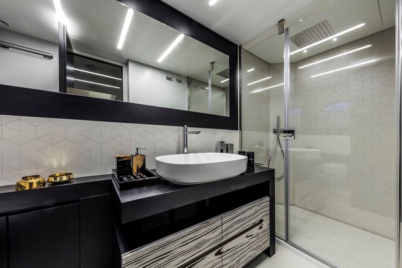 a bathroom with a sink and a shower unit aboard PERSHING 8X   Yacht for Sale