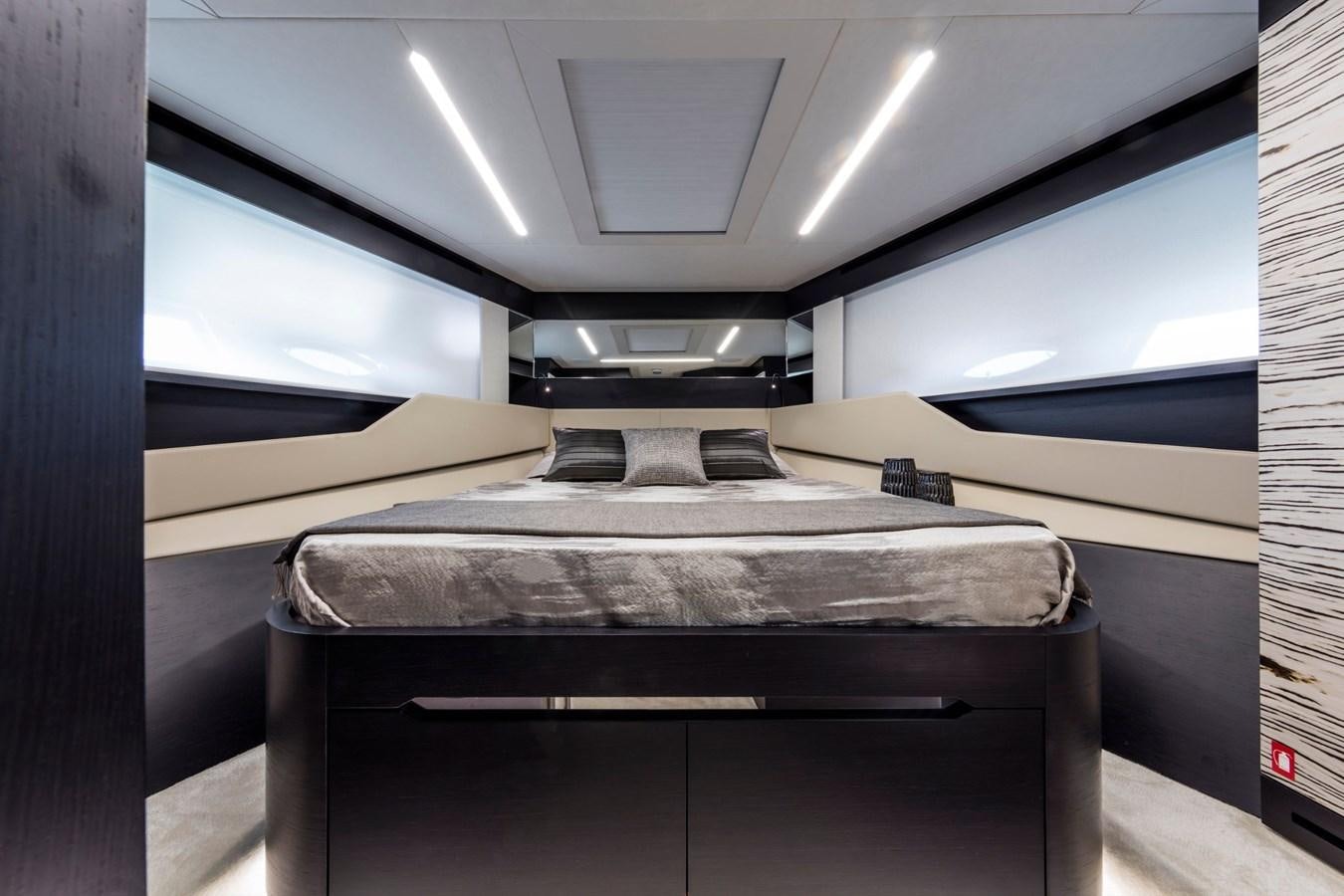 a bed in a room aboard PERSHING 8X   Yacht for Sale